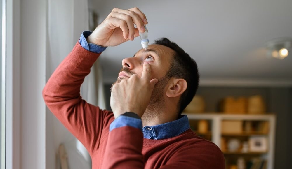 Beautiful young couple looking behind at you