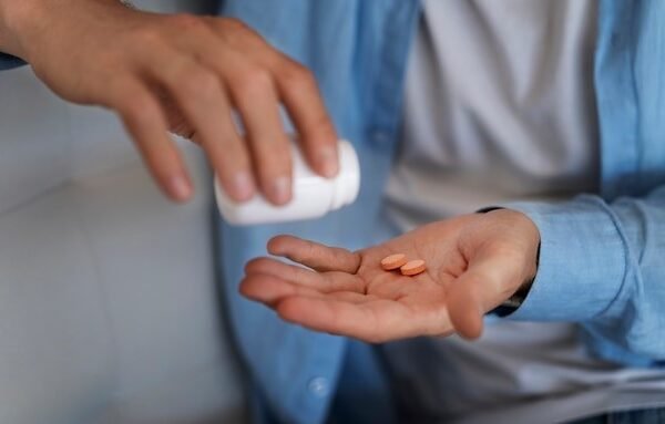 Beautiful young couple looking behind at you