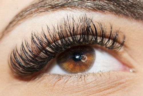 Beautiful young couple looking behind at you